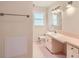Bathroom with pink tile, vanity, and toilet at 3701 Rainbow Cir, Snellville, GA 30039