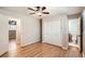 Bedroom featuring wood floors, a ceiling fan, closet, and an attached bathroom at 3701 Rainbow Cir, Snellville, GA 30039