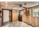 Versatile bonus room with wood paneling, storage, and natural light at 3701 Rainbow Cir, Snellville, GA 30039