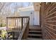 Wooden deck with stairs and brick siding at 3701 Rainbow Cir, Snellville, GA 30039