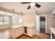 Well-lit kitchen featuring an island, tiled floors, pantry, and a ceiling fan at 3701 Rainbow Cir, Snellville, GA 30039