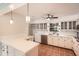 Bright kitchen with tiled floors, white cabinets, and updated stainless steel appliances at 3701 Rainbow Cir, Snellville, GA 30039