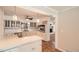 Stylish kitchen with tile floors, white cabinetry, breakfast bar and stainless steel oven at 3701 Rainbow Cir, Snellville, GA 30039