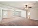 Spacious living room featuring neutral paint, ceiling fans, and ample natural light at 3701 Rainbow Cir, Snellville, GA 30039