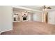 Open living room showcasing a brick fireplace, carpeted floors, and neutral paint at 3701 Rainbow Cir, Snellville, GA 30039