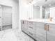 Elegant bathroom with double sinks, sleek cabinetry, and a glass-enclosed shower at 1239 Chelsea Nw Cir, Atlanta, GA 30318
