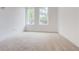 Bright, airy bedroom with plush carpeting and large windows at 1239 Chelsea Nw Cir, Atlanta, GA 30318