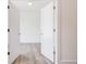 Open doorway showcases a bright, freshly painted room with modern flooring and natural light at 1239 Chelsea Nw Cir, Atlanta, GA 30318
