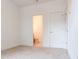 Bedroom with carpet, white walls, and a connecting door to the bathroom at 1239 Chelsea Nw Cir, Atlanta, GA 30318