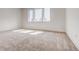 Bright and spacious bedroom with plush carpeting and three large windows, ready for personalization at 1239 Chelsea Nw Cir, Atlanta, GA 30318