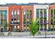 Stylish townhomes with arched windows, small balconies, and well-maintained front yards at 1239 Chelsea Nw Cir, Atlanta, GA 30318