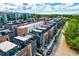 Contemporary townhome community featuring brick and modern siding, rooftop terraces, and lush landscaping at 1239 Chelsea Nw Cir, Atlanta, GA 30318