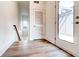 A modern hallway featuring stylish flooring, natural light, and access to outdoor space at 1239 Chelsea Nw Cir, Atlanta, GA 30318