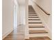 Hallway featuring stairs with wood treads and white risers at 1239 Chelsea Nw Cir, Atlanta, GA 30318
