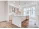 Bright kitchen features a large island, modern appliances, pendant lighting and large windows at 1239 Chelsea Nw Cir, Atlanta, GA 30318