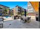 Outdoor kitchen and dining area with grill, table, and community pool in the background at 1239 Chelsea Nw Cir, Atlanta, GA 30318