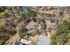 Aerial shot of residential homes and cul-de-sac nestled near a calm lake, showcasing community living at 2504 Loch View Sw Ct, Conyers, GA 30094