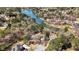 Aerial view of Lochinver neighborhood homes along a scenic lake, surrounded by lush greenery at 2504 Loch View Sw Ct, Conyers, GA 30094