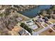 An aerial view showcases community pool and tennis courts alongside waterfront homes, highlighting recreational amenities at 2504 Loch View Sw Ct, Conyers, GA 30094