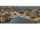 Aerial view showing the community pool, tennis courts, lake and lush greenery at 2504 Loch View Sw Ct, Conyers, GA 30094