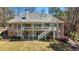 Scenic backyard features a large deck and patio area, perfect for entertaining at 2504 Loch View Sw Ct, Conyers, GA 30094