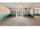 Large basement with ceiling fan, walkout french doors, and a view of the backyard at 2504 Loch View Sw Ct, Conyers, GA 30094