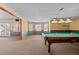 Spacious basement features a billiard table and walkout access to a screen porch at 2504 Loch View Sw Ct, Conyers, GA 30094