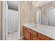 Classic bathroom showcases vanity with ample counter space and a shower with neutral tile at 2504 Loch View Sw Ct, Conyers, GA 30094