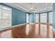 Expansive bedroom with tray ceilings, multiple windows, and hardwood floors at 2504 Loch View Sw Ct, Conyers, GA 30094