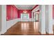 Formal dining room with hardwood floors, decorative moldings, and large windows at 2504 Loch View Sw Ct, Conyers, GA 30094