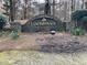 Stone entrance sign displaying 'Lochinver' with daffodil landscaping, creating a welcoming neighborhood aesthetic at 2504 Loch View Sw Ct, Conyers, GA 30094