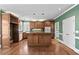Well-appointed kitchen with wooden cabinets, central island, and modern appliances at 2504 Loch View Sw Ct, Conyers, GA 30094