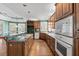 Gourmet kitchen with an island, a wine rack, and stainless appliances at 2504 Loch View Sw Ct, Conyers, GA 30094