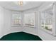 Cozy sunroom features lots of natural light streaming in from windows with green outdoor views at 2504 Loch View Sw Ct, Conyers, GA 30094