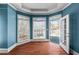 Sitting room with large windows, a door to the outside, and hardwood floors at 2504 Loch View Sw Ct, Conyers, GA 30094