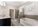 Relaxing bathroom with a soaking tub and glass shower at 736 Red Wolf Run, Atlanta, GA 30349