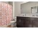 Bathroom featuring a double vanity with dark cabinets at 736 Red Wolf Run, Atlanta, GA 30349