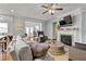 Cozy living room featuring a fireplace, large sectional sofa, and elegant decor at 736 Red Wolf Run, Atlanta, GA 30349