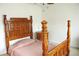 Traditional bedroom featuring a beautiful dark wood bed frame with detailed posts and headboard at 179 Hunters Crk, Dallas, GA 30157