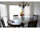 Cozy dining area with a round table, chairs, and a bay window, perfect for Gathering meals at 179 Hunters Crk, Dallas, GA 30157