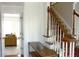 Spacious foyer with hardwood floors, staircase, and a view into the living room at 179 Hunters Crk, Dallas, GA 30157