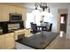 Modern kitchen featuring white cabinets, stainless steel appliances, black countertops, and an island at 179 Hunters Crk, Dallas, GA 30157