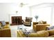 Comfortable living room with a brick fireplace, plush seating, and a large window for natural light at 179 Hunters Crk, Dallas, GA 30157