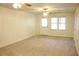 A cozy and inviting living room filled with natural light and ceiling fans at 179 Hunters Crk, Dallas, GA 30157