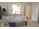 Bright main bedroom features a double bed with a private ensuite bathroom at 179 Hunters Crk, Dallas, GA 30157