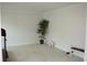 Neutral room with carpet, a small lamp, a potted plant, and workout bench, perfect for an office or workout room at 179 Hunters Crk, Dallas, GA 30157
