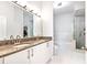 Stylish bathroom features a double vanity, granite counters, walk-in shower and a separate tub at 390 17Th Nw St # 5031, Atlanta, GA 30363