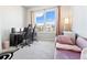 Bedroom features a window with a view and plush furniture; suitable for work or relaxation at 390 17Th Nw St # 5031, Atlanta, GA 30363