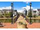 A scenic bridge on a waterfront with views of modern apartment buildings under a blue sky at 390 17Th Nw St # 5031, Atlanta, GA 30363