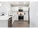 Contemporary kitchen with stainless steel appliances and light wood flooring at 390 17Th Nw St # 5031, Atlanta, GA 30363